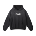 Premium black hoodie with a minimalist white "PEACE" script graphic on 100% heavyweight cotton.