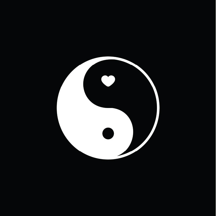 Yin yang symbol with a heart and circle inside on a black background