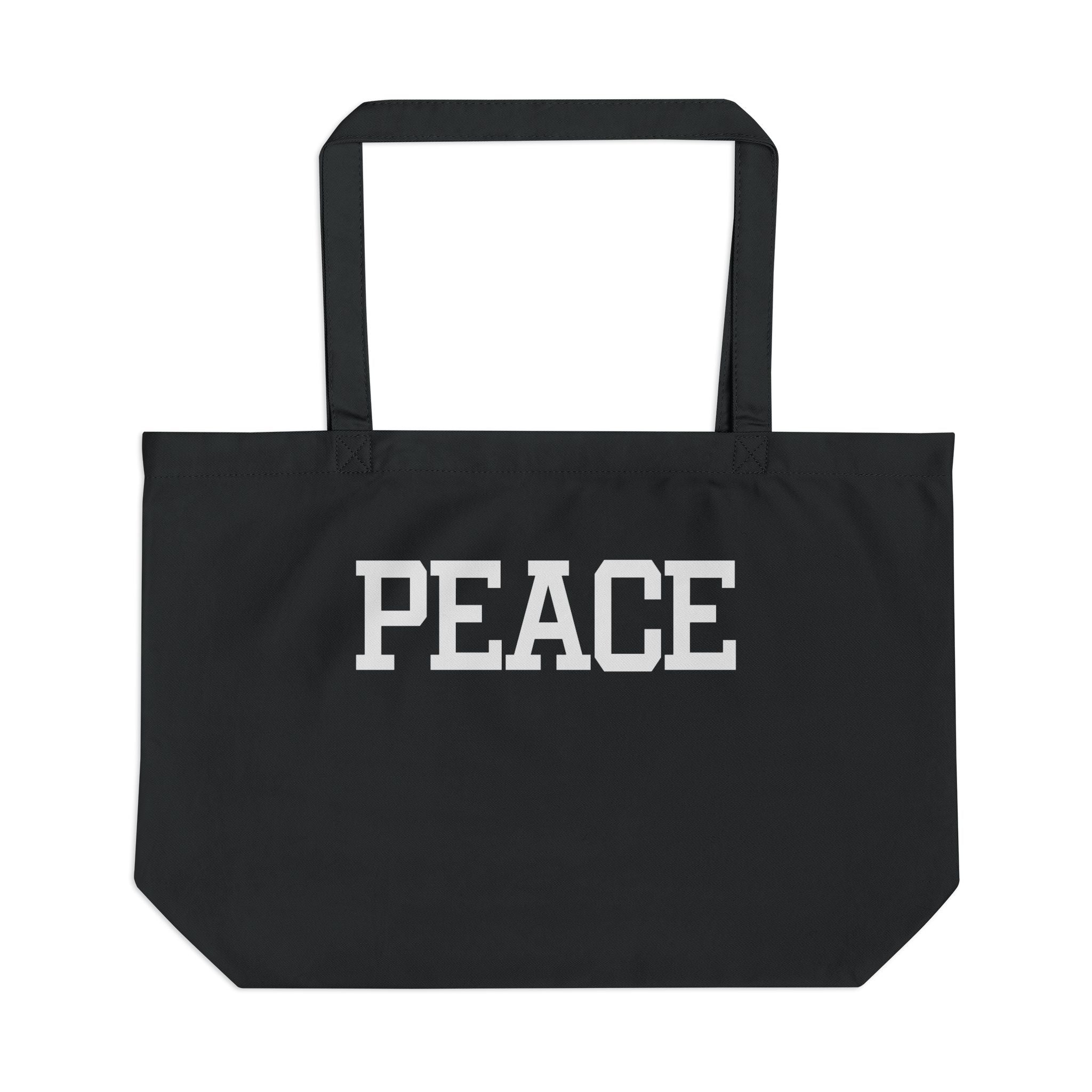 Black tote bag with 'PEACE' printed on it against a white background